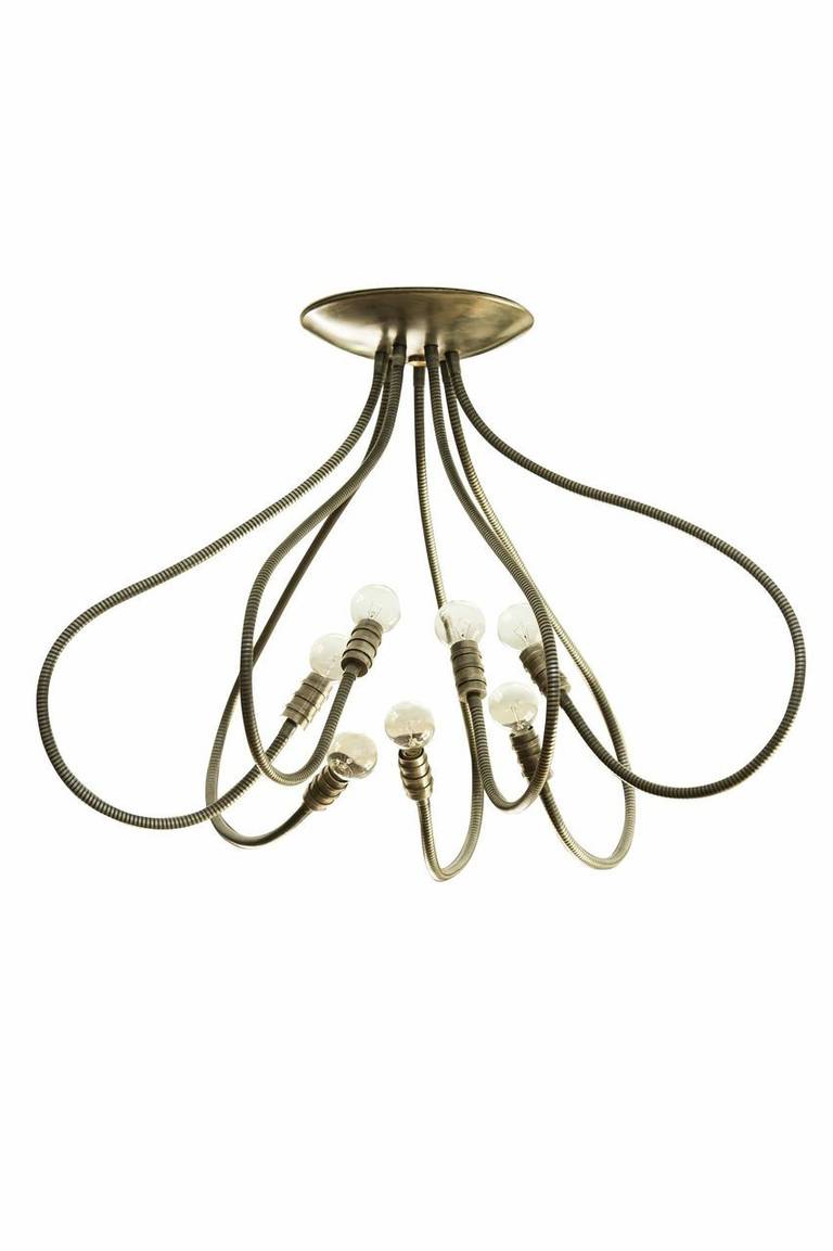 Custom made, seven-arm adjustable arm ceiling mounted chandelier. Shown here in brushed brass finish with our signature canister fitting, different finishes, and custom sizes available. Overall dimensions depend on how you position the arms.