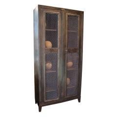 Steel armoire cabinet with mesh panel doors