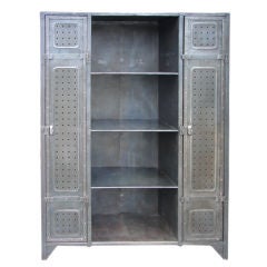 Steel bookcase with perforated panel doors