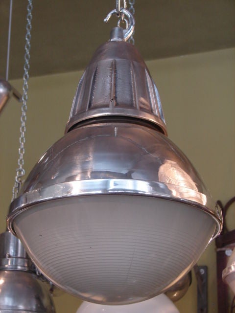 Mid-20th Century Polished steel and holophane glass industrial pendant light