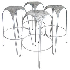 Two stools with pierced metal seats