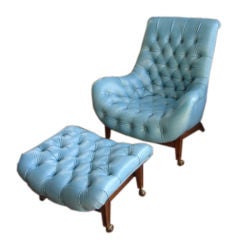 Blue tufted leatherette chair and ottoman