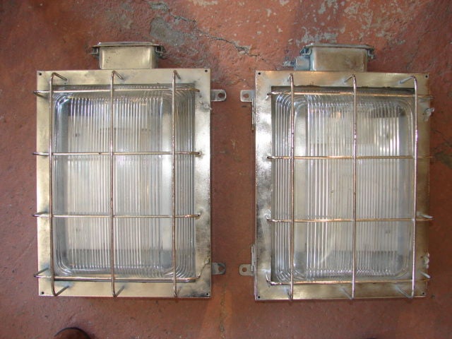 Pair of steel and holophane wall lights