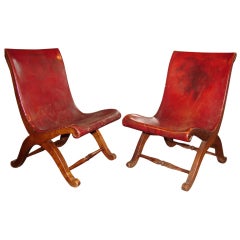 Pair of red leather studded library slipper chairs