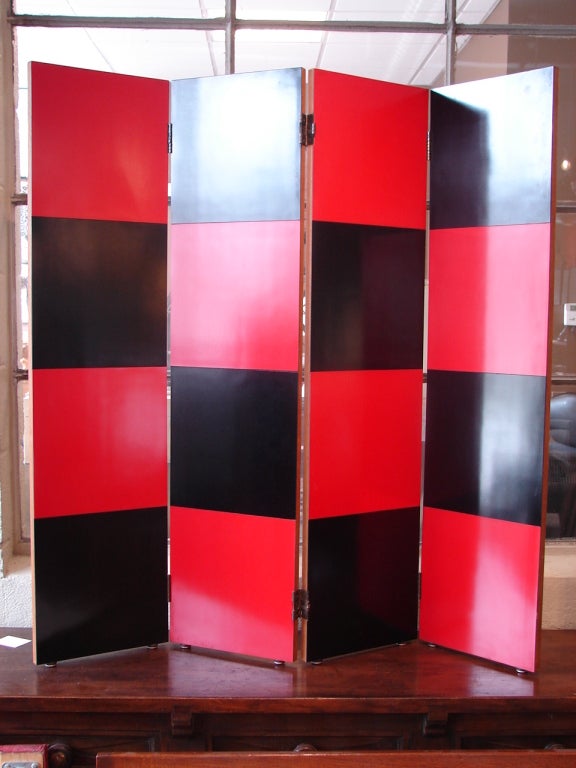 Four panel folding screen, oak panels with laminate black and red squares;
Avantgarden Ltd. cultivates unexpected and exceptional lighting, furniture and design. To view items in person please visit our showroom in Pound Ridge, New York.