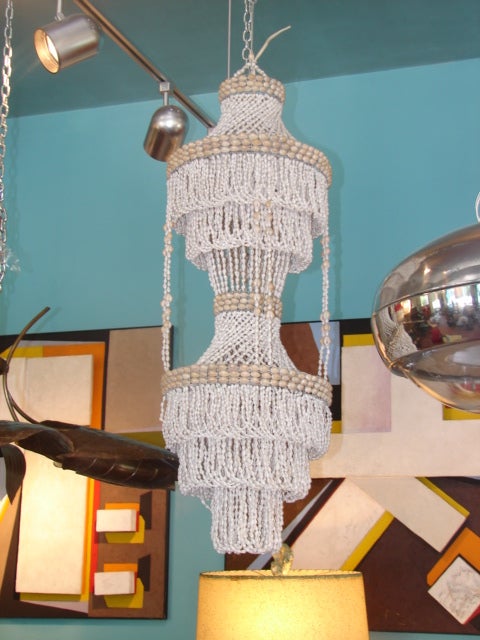Whimsical shell pendant; lights in top and bottom sections