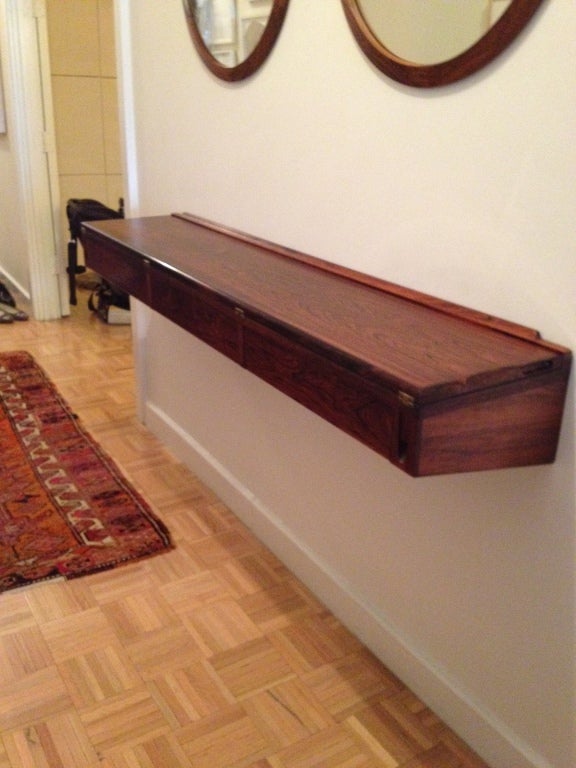 Danish rosewood flip top desk with black laminate interior surface. Three drawers.