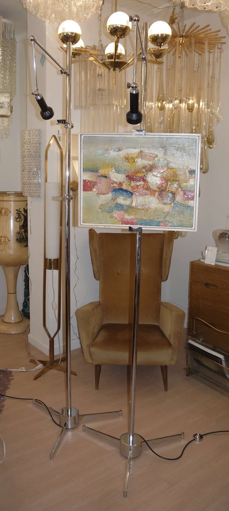 70's Angelo Lelli for Arredoluce easels. Markings on the switch of the easel (Made in Italy, Arredoluce Monza). an articulated arm on top permits to spotlight the painting held by two adjustable arms. The arms holding the painting can be adjusted to