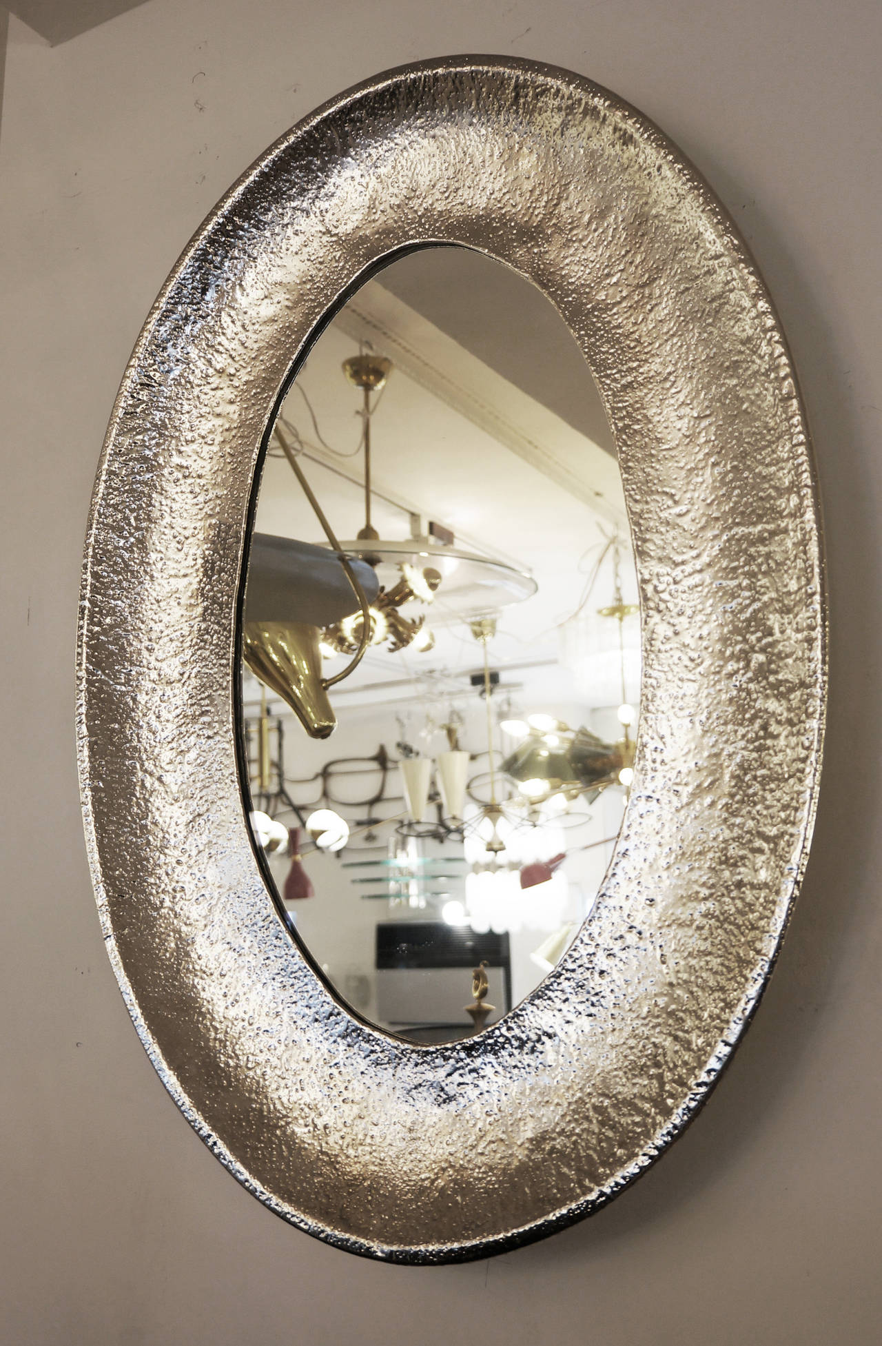 The rich texture, made even more dramatic by the nickel plating, makes this mirror a special piece. Angelo Bragalini made a few pieces in this manner.