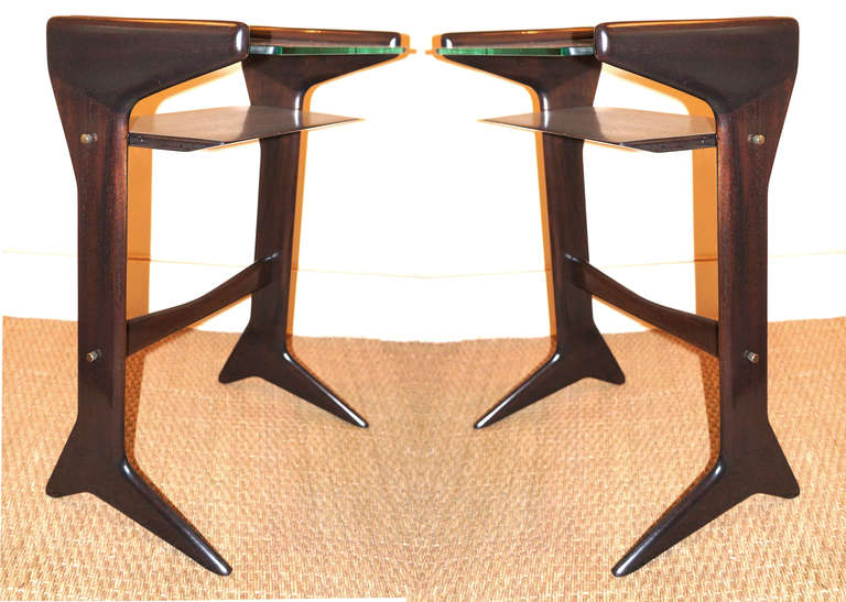 Very elegant small tables with a glass top and a wooden shelf made of darkened mahogany with brass details. It was most likely designed by Guglielmo Ulrich as the shape of the legs is a specific Ulrich design used in some of his desks.