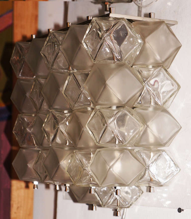 Sculptural and rare pair of Murano glass wall sconces made with alternating sandblasted and clear faceted glass cubes. Each sconce has 3 sockets.