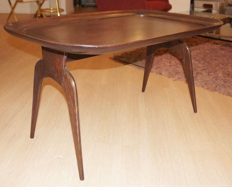 Elegant oak coffee table designed by Cesare Lacca. The reverse diapason shaped legs and the frame surrounding the top are notable design elements that make this table different from any other Mid-Century table.