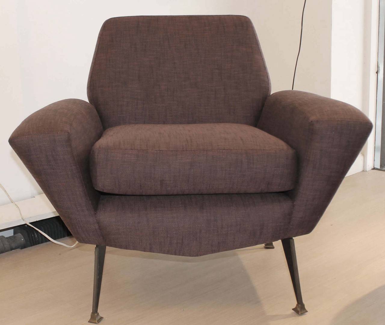 Striking 1950s armchair with a sleek design and sophisticated legs . Has been attributed to Gigi Radice that worked for Minotti a company created in the 1950s and that is still active to this day. The one available is still in original condition. 