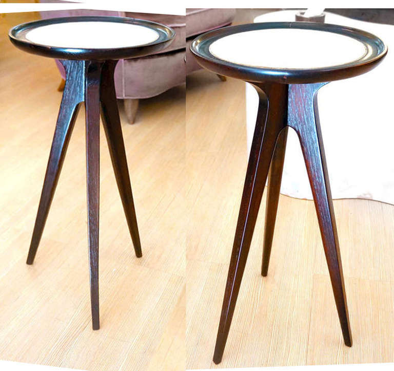 Pair of white leather top diminutive side tables by Jon Van Der Koert for Drexel. The table top has raised edges and stands on three legs. Solid oak. van der kort (1912-1998) was a Canadian of Dutch ancestry. Studied painting and sculpture and
