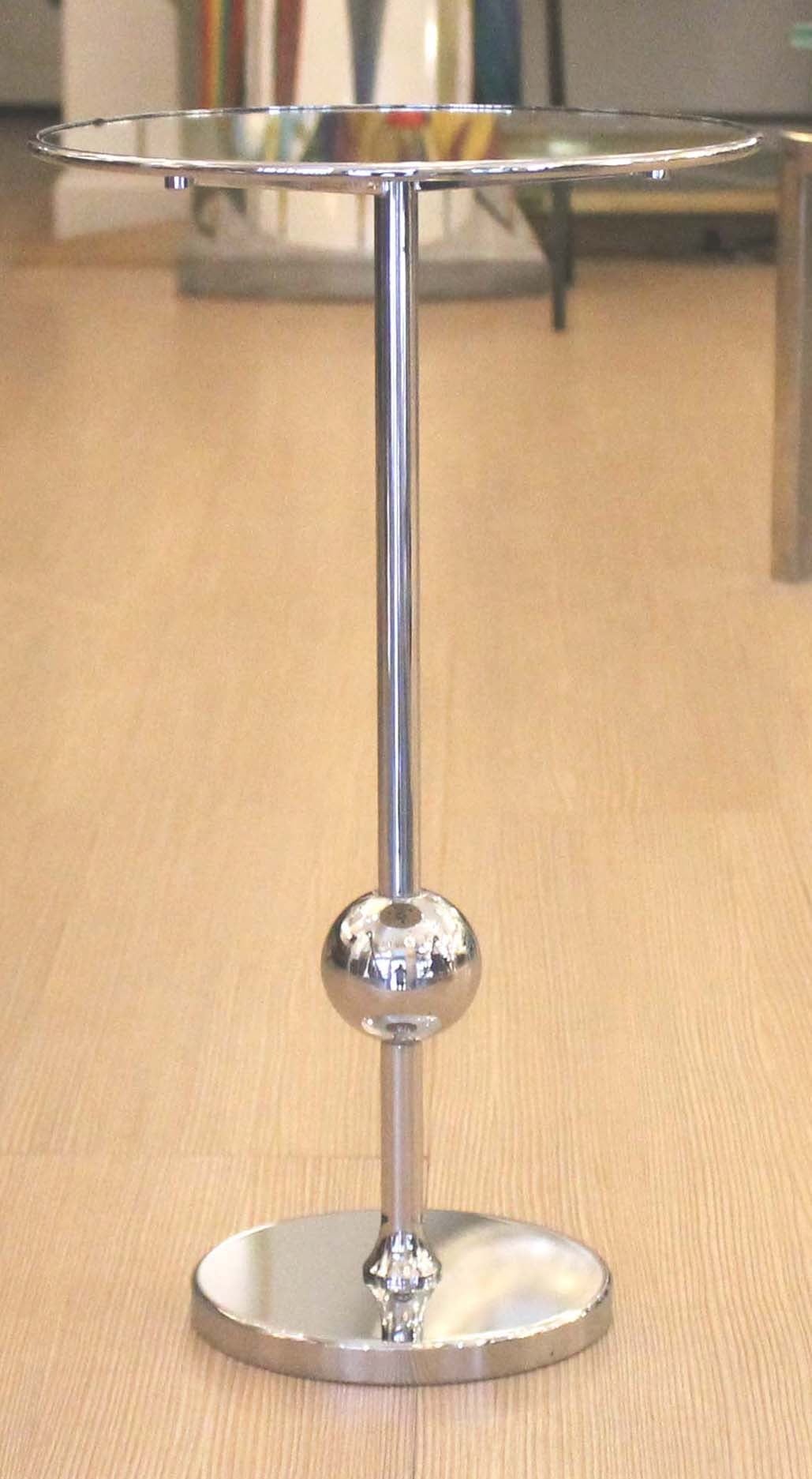 Diminutive nickel plated side table. The top is a silvered mirror. The stem connecting the base to the top has a sphere in the lower part. Small tables with a sphere are commonly attributed to Osvaldo Borsani one of the most important Italian