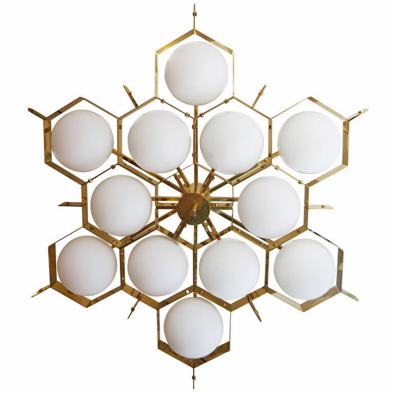 Large flush mount fixture with twelve glass spheres encased in a brass bee hive-like structure. Made in limited quantities exclusively for Gaspare Asaro.  Please beware that there are copies of this fixture and that this one is the only one