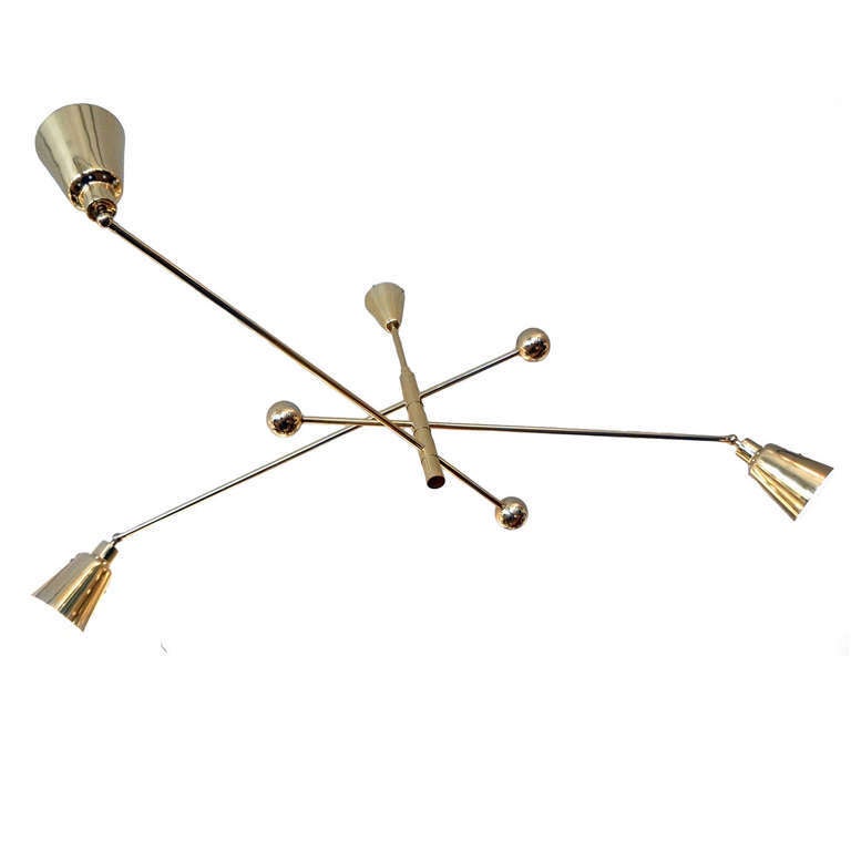 Large brass chandelier with three rotating arms ending in shades adjustable in every direction. Produced in limited quantities by Italian artisan Fedele Papagni exclusively for Gaspare Asaro- Italian modern. Height can be adjusted. 

Maximum