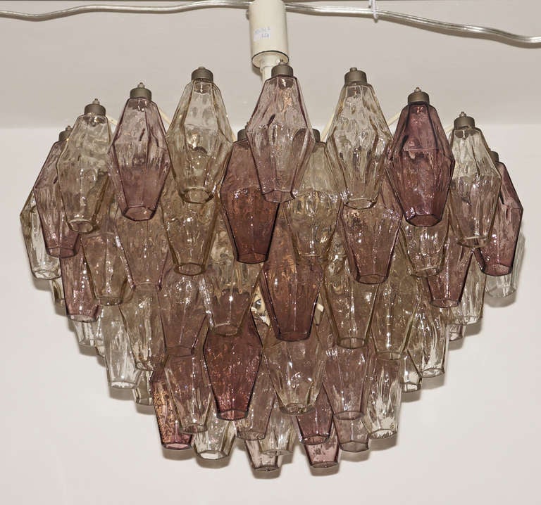 The supporting structure and the quality of the hand blown glasses suggest this is a very early version of the polyhedral chandeliers that were a trade mark of the Venini house. Designed by Carlo Scarpa the polyhedral chandelier reached a tremendous