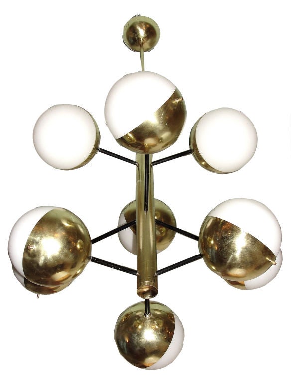 A rare and striking Stilnovo creation with nine opaline (sanded) glass spheres held by demi-lune brass cups.  Central arms are longer than the top and the bottom ones. Among the great Stilnovo designs this one stands as one of the best ones.  The