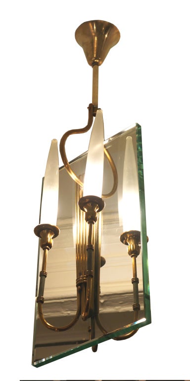 Exquisite Italian chandelier in the manner of Pietro Chiesa for Fontana Arte a thick glass slab connects four brass arms ending in sanded glass shades. Green marble like sections enrich the four brass arms.

