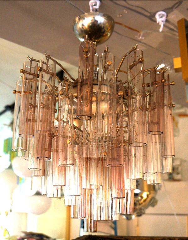 Whimsical chandelier made by tens of hand blown glass tubes hanging from a nickel plated structure. Glass tubes are clear and two  mild aubergine tones. This kind of chandelier have been attributed to both Venini and Barovier and Toso. Makes a