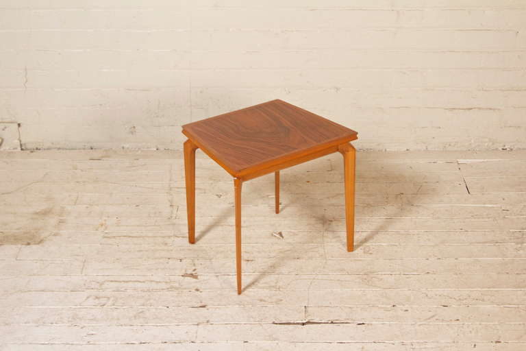 Rare and elegant side table by Czech-born architect and taste-maker Erno Fabry featuring solid cherry legs and a masterfully-applied rosewood veneer. Made in Belgium and imported by Erno Fabry Associates. 

(Pair available, the other in walnut,