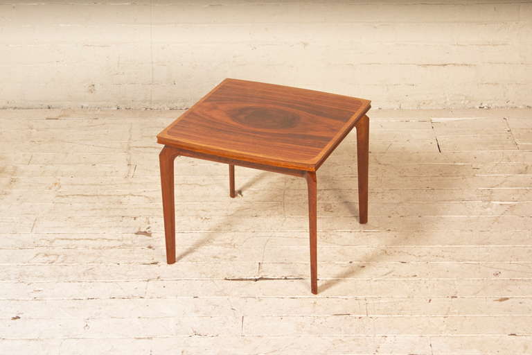 Handsome little side table by Czech born architect and taste-maker Erno Fabry featuring beautifully-sculpted European Walnut legs and a stunning, bookmatched rosewood veneer. Made in Belgium, imported by Erno Fabry Associates.

(Pair available, the