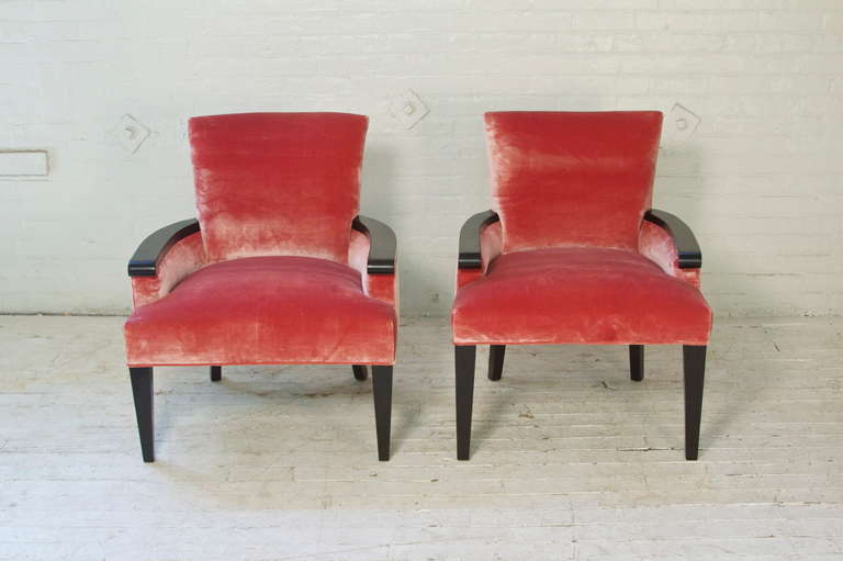 Good-looking pair of late 60's armchairs by John Hutton for Donghia in the Louis XVI-style of the period, featuring a solid beechwood frame re-done with dark chocolate walnut finish. They've been completely reupholstered in pink velvet-silk from