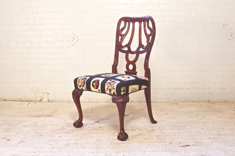 Gorgeous Georgian style side chair in Cuban mahogany with original tapestry upholstery, expertly carved ball-and-claw feet, and an Eastern-influenced flowing back-splat. The design filling the hooped back is unique; being an open convex strap-work