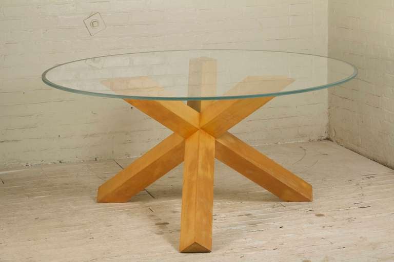 Iconic table by Mario Bellini with original round glass top supported by an interesting geometric natural ash wood base. The glass top has frosted edges. A signature design manufactured by Cassina.