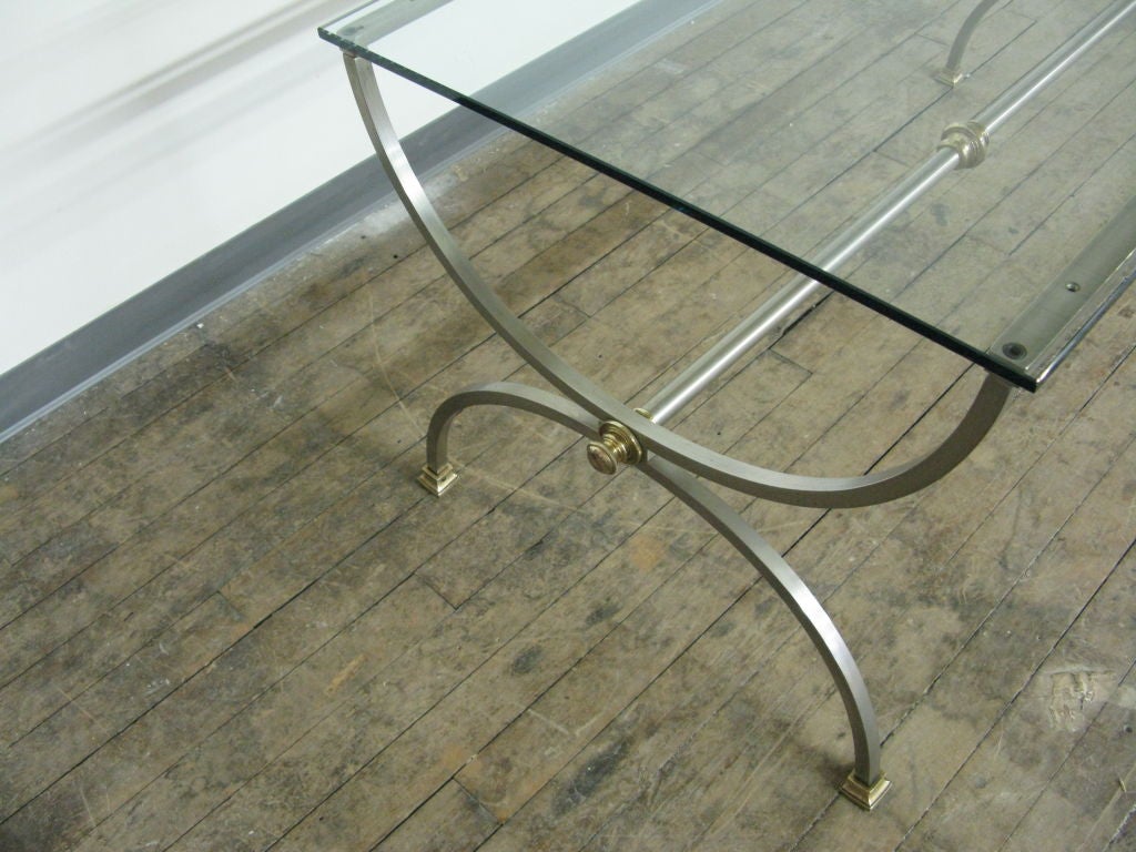 Good looking Italian brass and steel neoclassical style table with glass top.Stamped Italy.