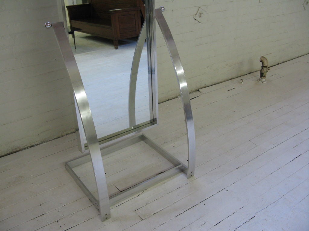 Very useful free standing chrome framed cheval mirror with adjustable position supported by a sculptural base-mount