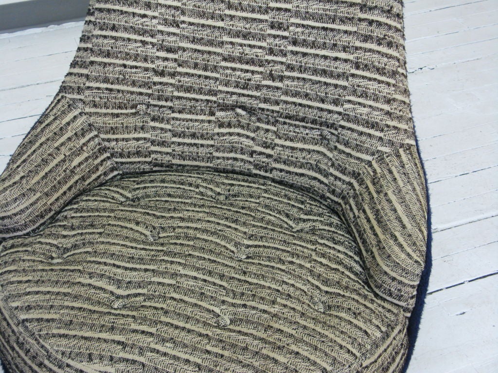 Pair of armless slipper swivel chair upholstered with original  two color wool material and supported by round walnut base.