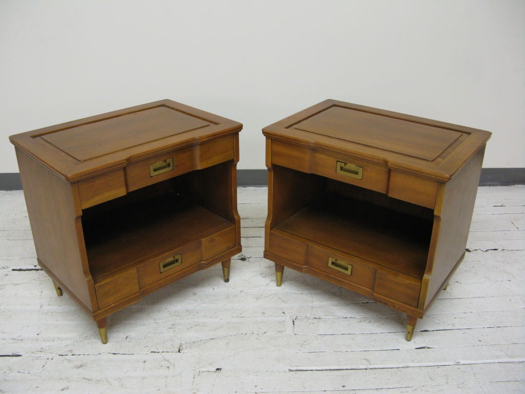 Pair of natural walnut 2 drawers block front night stands by J.Widdicomb with brass hardware and feet.Part of bedroom set.<br />
We also have the complete Queen size bed.Sold as is.