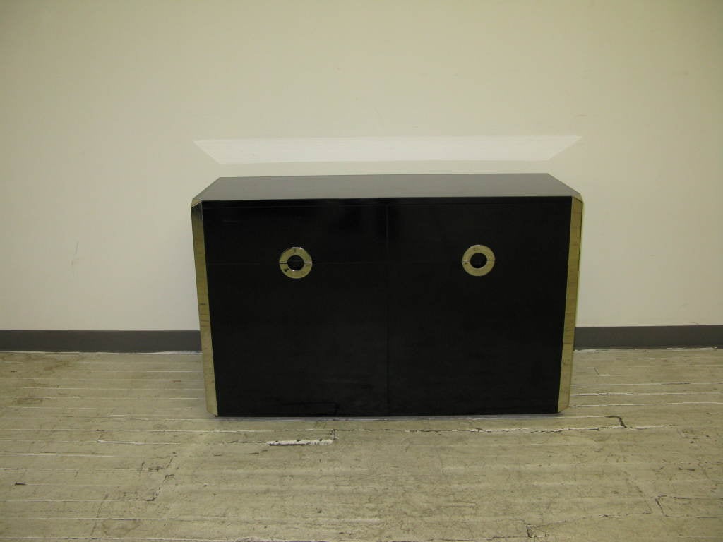 1970's Italian buffet cabinet by W.Rizzo edited by Mario Sabot,in black melamine and chromed metal decoration.Buffet has pair of drawers and pair of lower doors with single shelf each for storage.This piece is part of the line edited by Mario Sabot