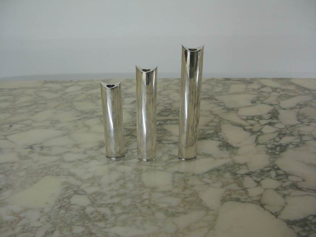 Good looking set of three graduated silver plated bud vases by Lino Sabattini. Marked with maker logo made in Italy.