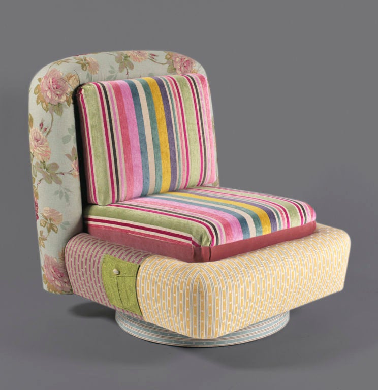 This vintage 1970's chair has been re-upholstered by hand using textiles from around the globe. The unique shape and movement of the chair is accented by the whimsical colors and patterns of the high quality fabric. This unique 
treasures.

Using