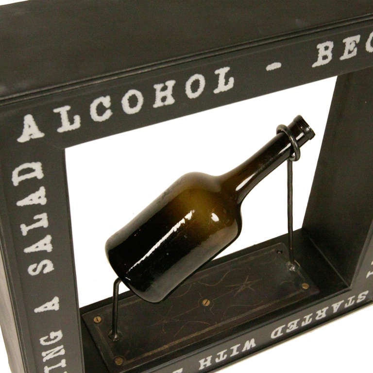 We have begun a vintage bottle shadow box series in the voila! Studio. This quirky piece is made to add a touch of whimsey to your decor. The shadowbox is entirely custom, with a custom made metal base and hand drawn type by our in house artisans.