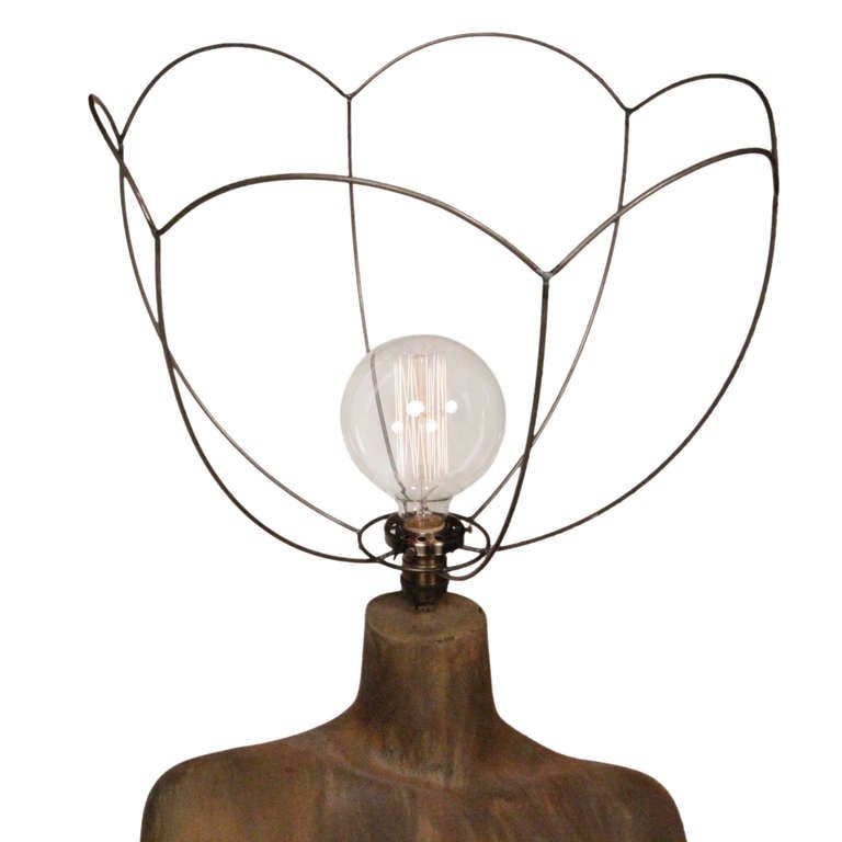 Our Bell Flower Lamp is a new addition to our Bringer of Light Collection. The mannequin has a custom rust finish, which is unique to each piece, and is wired with exposed incandescent bulbs. We added a touch of whimsey with the wired bell flower