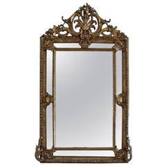 Large Richly Ornamented Giltwood and Paint Pierced Crested French Mirror