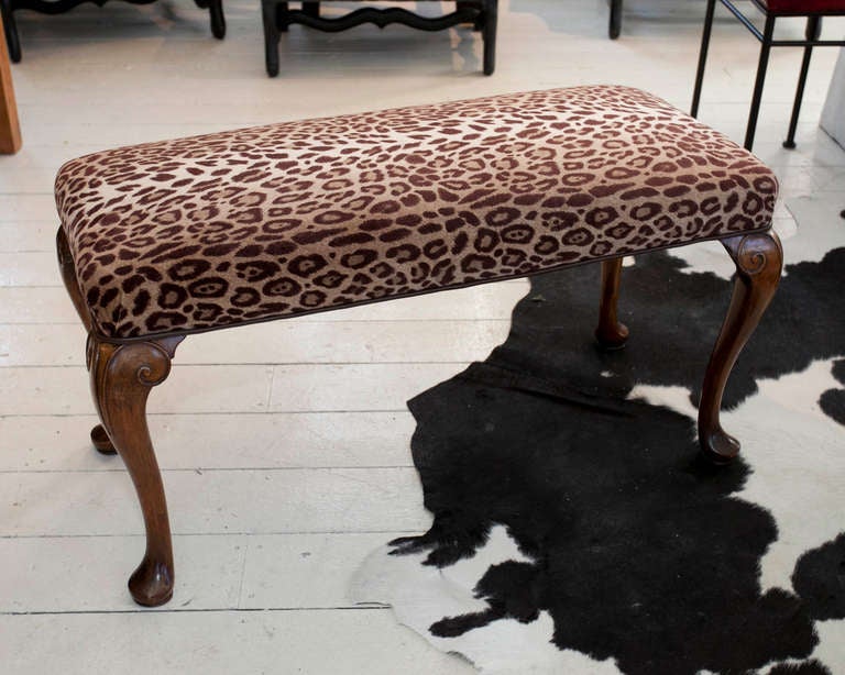 Early 20th century bench with carved cabriole legs.  Updated with leopard patterned velvet seat piped in leather welting.