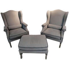 Pair of 19th Century Os de Mouton Wingback Chairs with Matching Ottoman