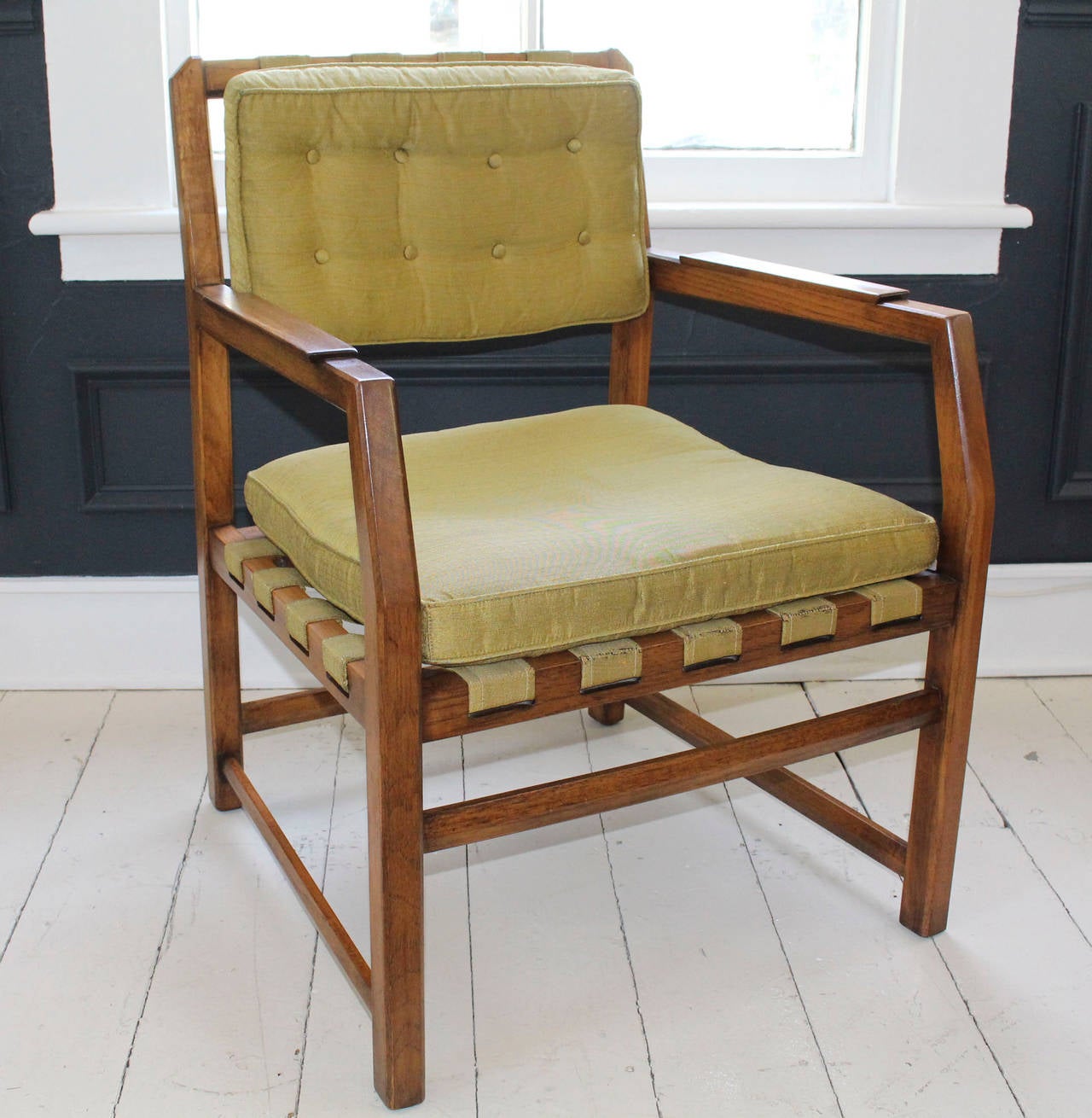Mid-Century set of six heritage teak lounge chairs, possibly with original olive green silk-like upholstery. Upholstered webbing supports attached buttoned back cushion and loose seat cushion.