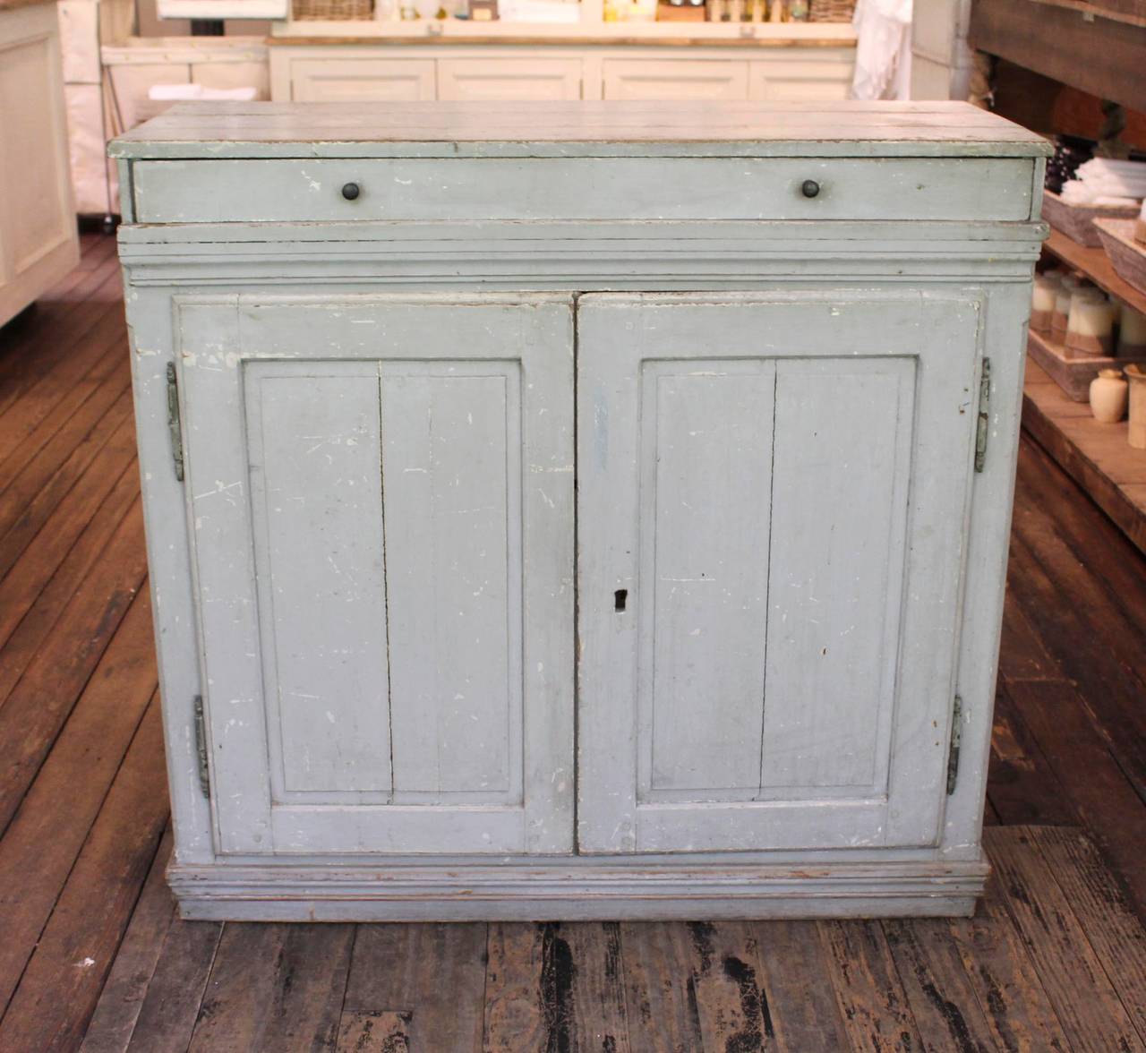 Double Door Sideboard, 19th c Sweden, in Grey Blue Paint.  Single Drawer Atop Double Door Concealing Single Shelf on Left Side and Two Shelves on Right Side.  Finished Painted and Paneled Back Allows Sideboard to Float in a Room.