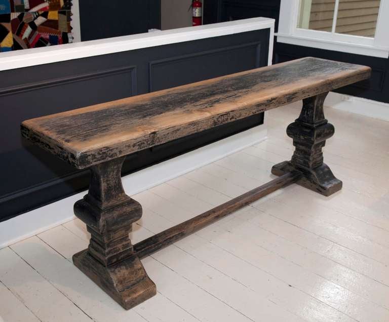 Handcrafted ebonized console table with trestle base fabricated in elmwood.