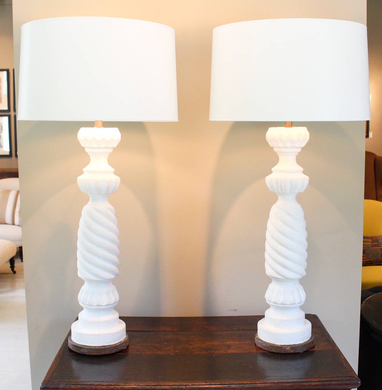 Pair of white plaster spiral twist table lamps on iron base. White card shades (18