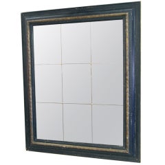 Monumental Ebonized and Gilt Mirror