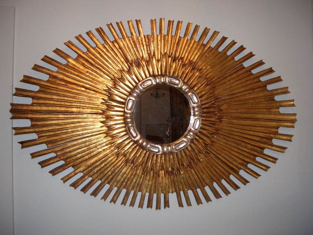 Stunning Italian sunburst mirror in a very rare oval shape.
May be hung horizontally or vertically.