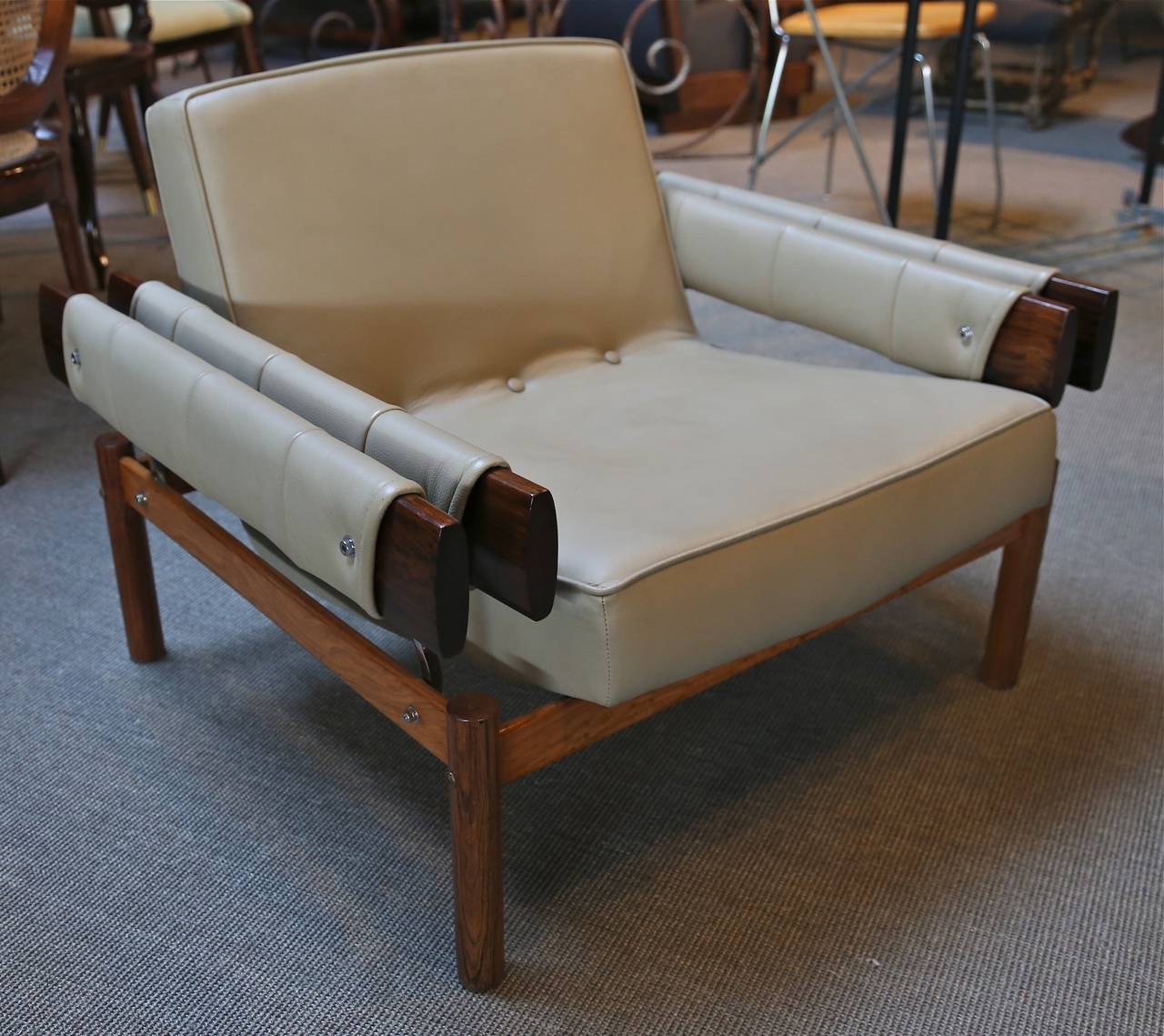 Pair of 1960s Brazilian jacaranda club chairs upholstered with beige leather, by Percival Lafer.