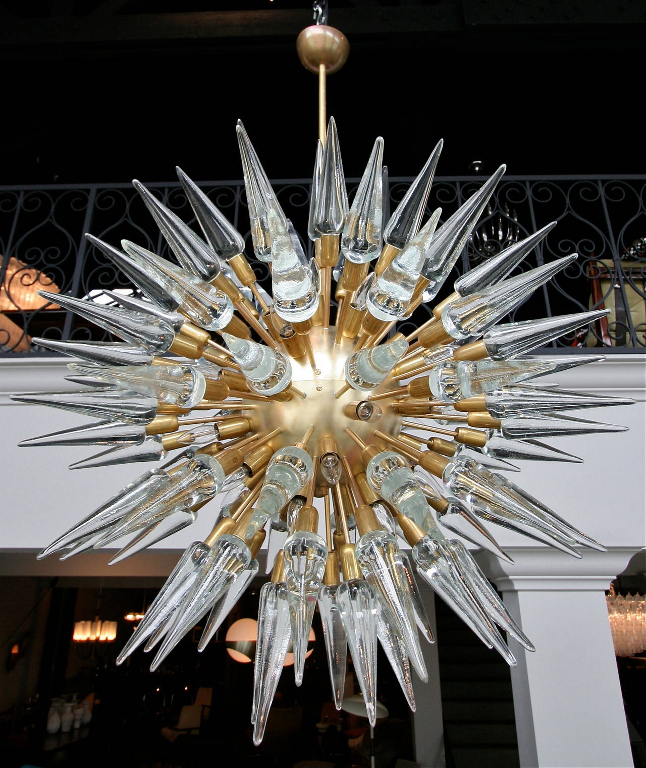 Sputnik chandelier with 95 cone-shaped glass pieces on brass globe frame. Priced individually.